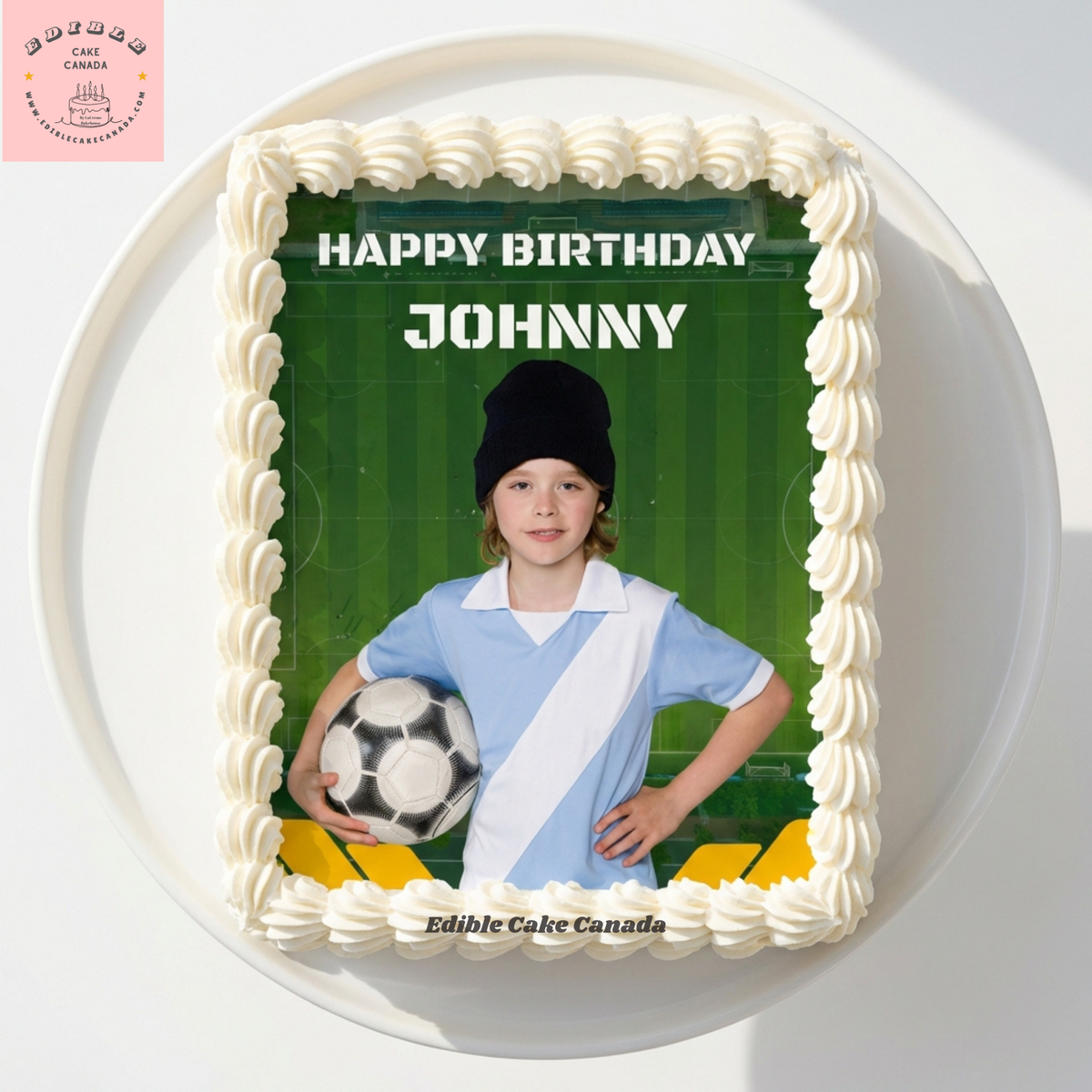 Custom edible icing cake topper with green soccer field background and Happy Birthday text on a birthday cake