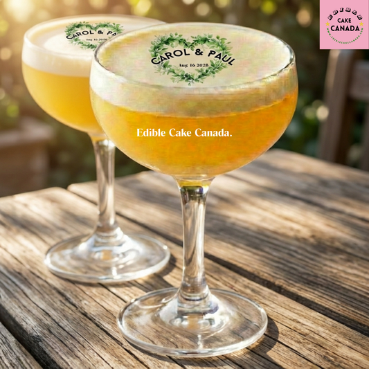 personalized edible drink toppers, edible wafer paper drink toppers, custom drink toppers Canada, wedding drink toppers, anniversary drink toppers, greenery heart drink topper, custom names date drink topper, edible cocktail toppers, bridal shower drink decor, engagement party drink toppers, personalized wedding bar decor, custom edible toppers, couple celebration drink decor, Canada wedding decor, Toronto wedding drink toppers, Vancouver wedding decor, Montreal wedding party supplies, Calgary wedding decor