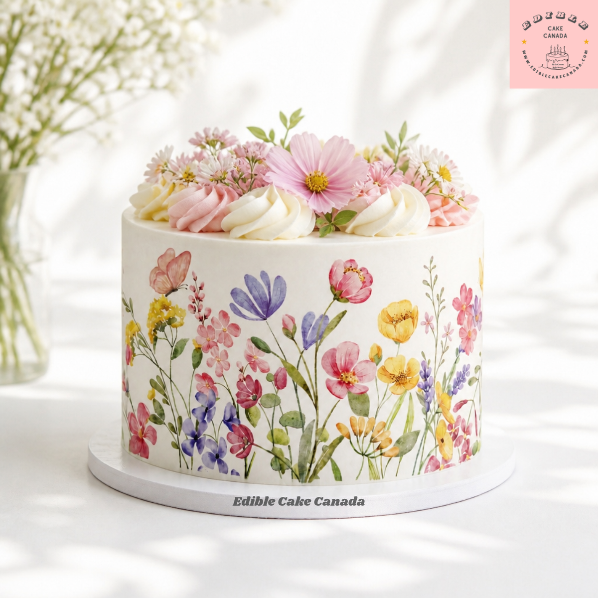 Edible icing sheet with pink butterfly and pink, purple, yellow, blue wildflowers