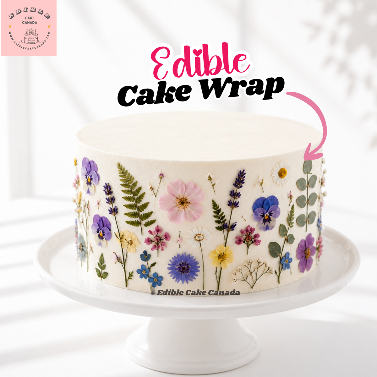 Cottagecore baby shower cake decorated with a pressed wildflower edible icing sheet border in blush and sage