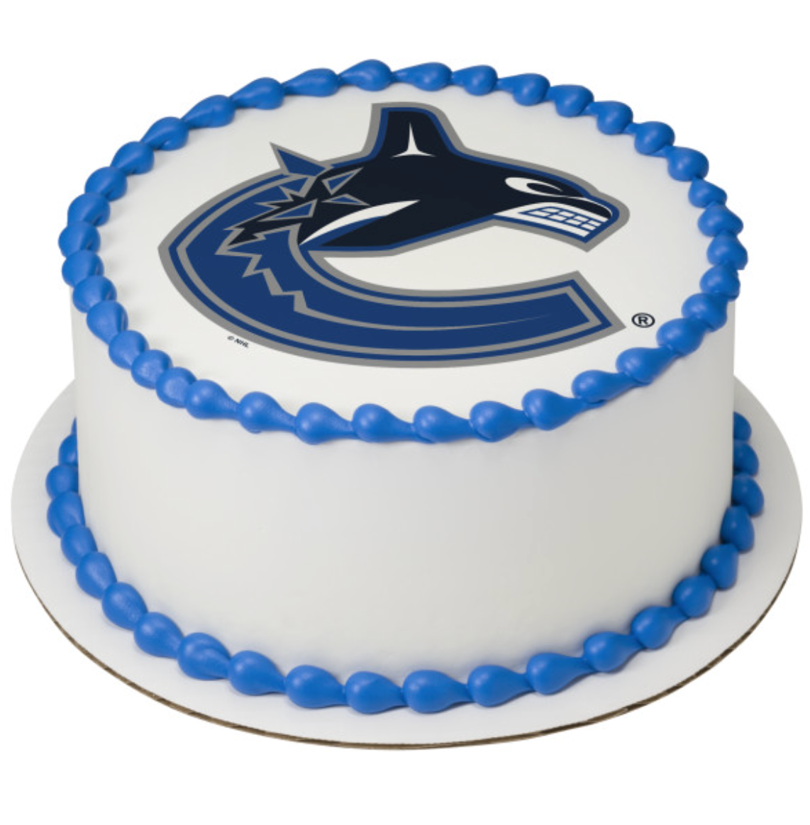 NHL® Licensed Vancouver Canucks PhotoCake® Edible Image® cake topper on white frosted cake, official team colors and logo
